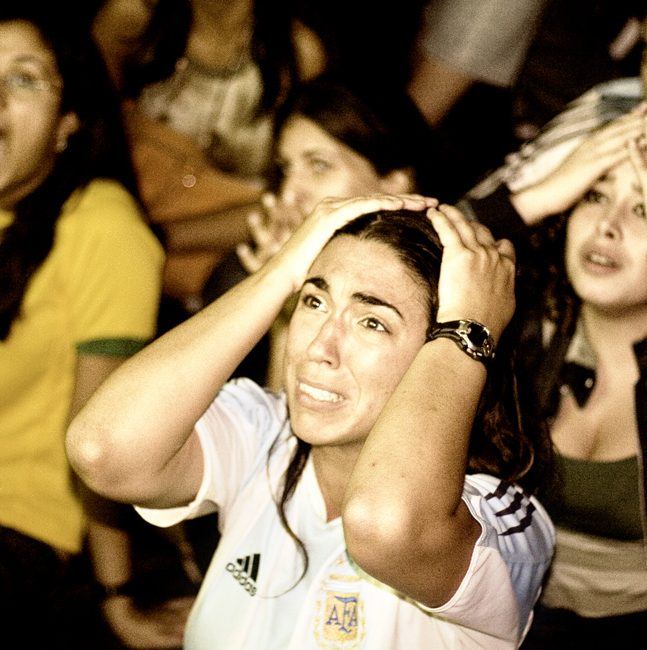Football fan as Argentina's fourth penalty is stopped by the German goalie