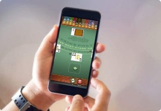 Image of someone playing at an online blackjack site on their mobile